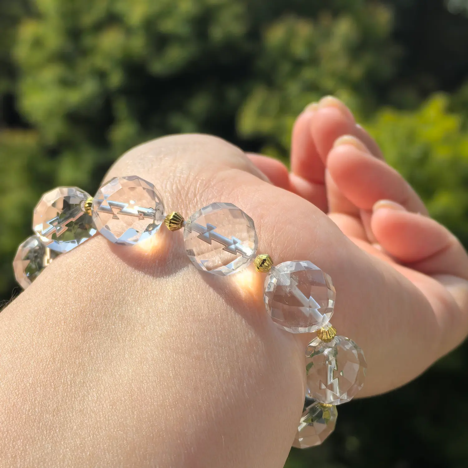 Amethyst Clear Quartz Super Seven Bracelet worn on wrist in natural light | QZZEN
