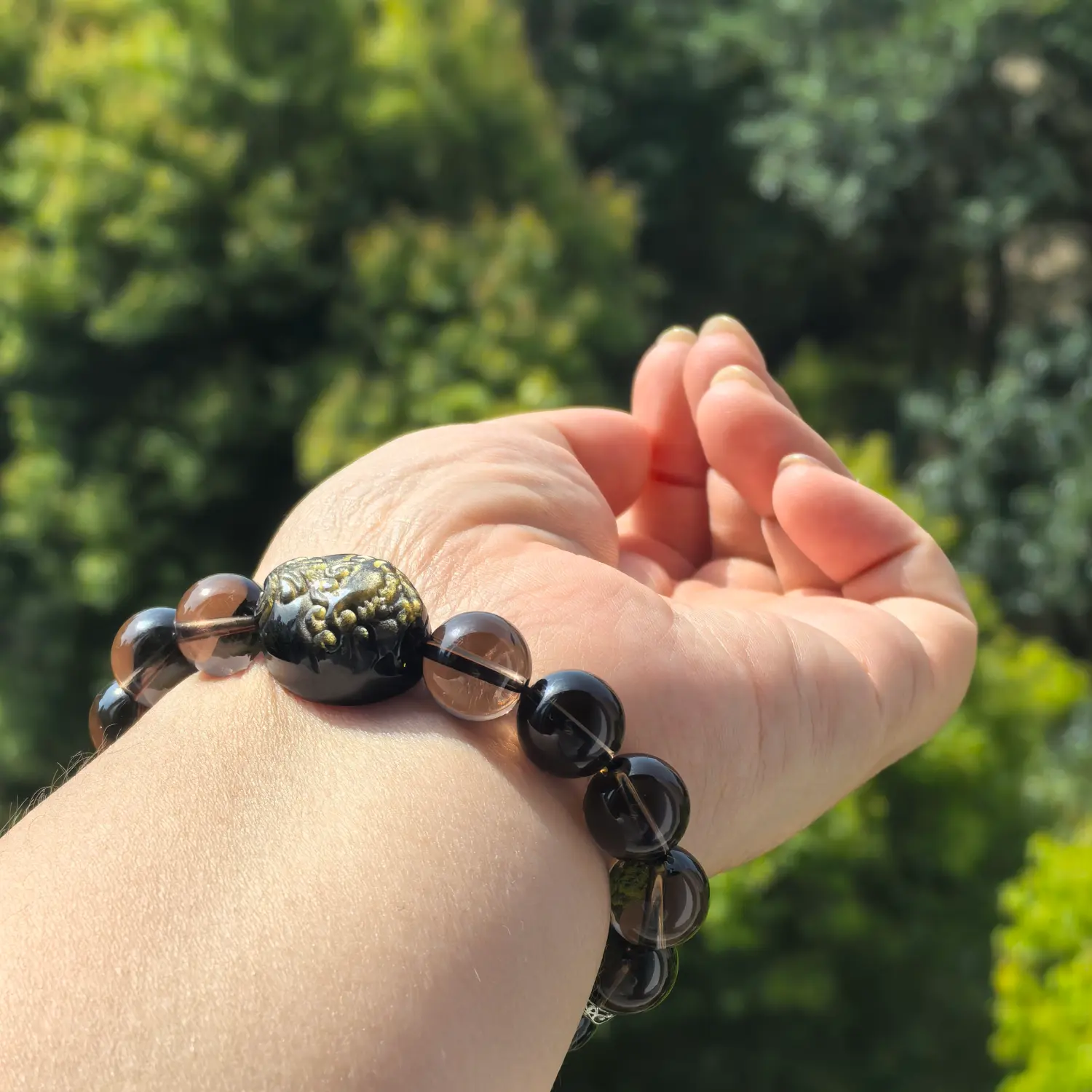 Obsidian Smoky Quartz Bracelet worn on wrist in natural light | QZZEN