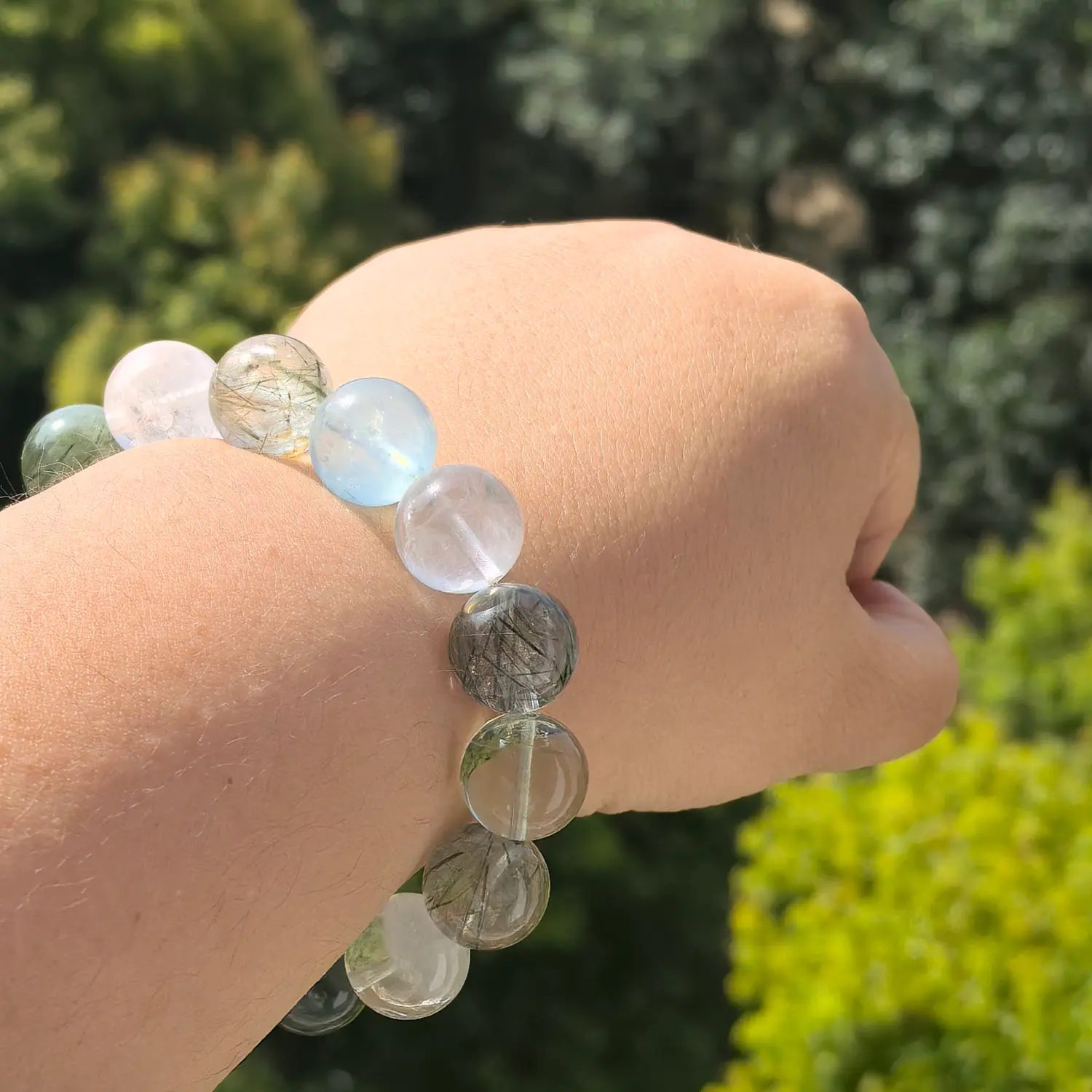 Clear Quartz Aquamarine Black Rutilated Quartz Bracelet worn on wrist in natural light | QZZEN
