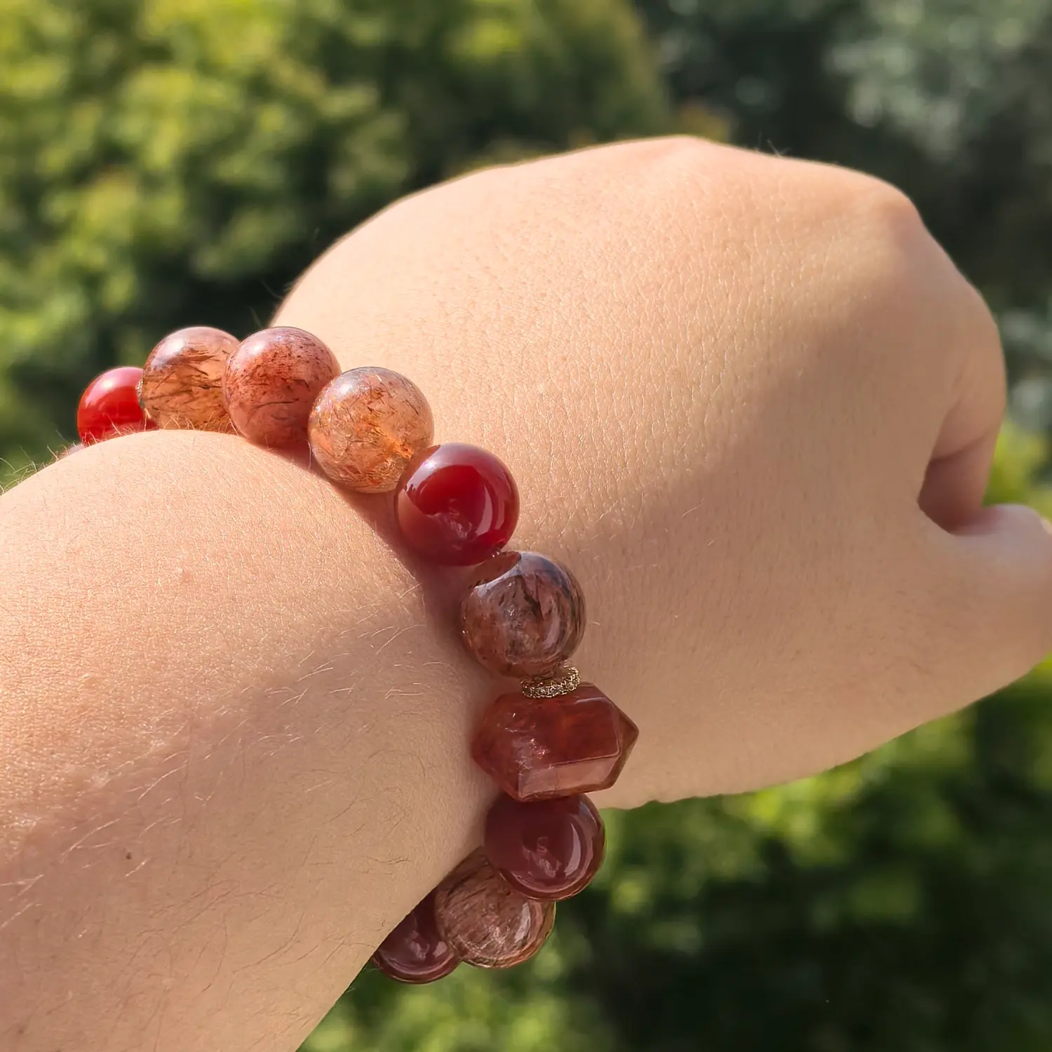 Copper Rutilated Quartz Red Agate Bracelet worn on wrist in natural light | QZZEN