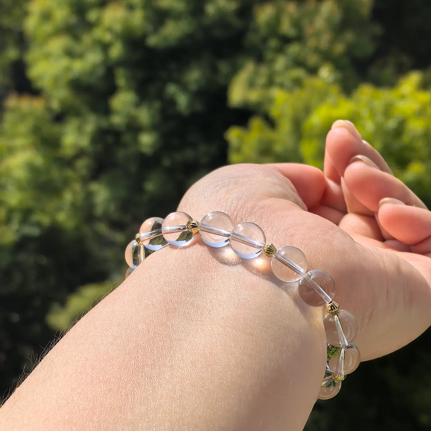 Clear Quartz Strawberry Quartz Bracelet worn on wrist in natural light | QZZEN