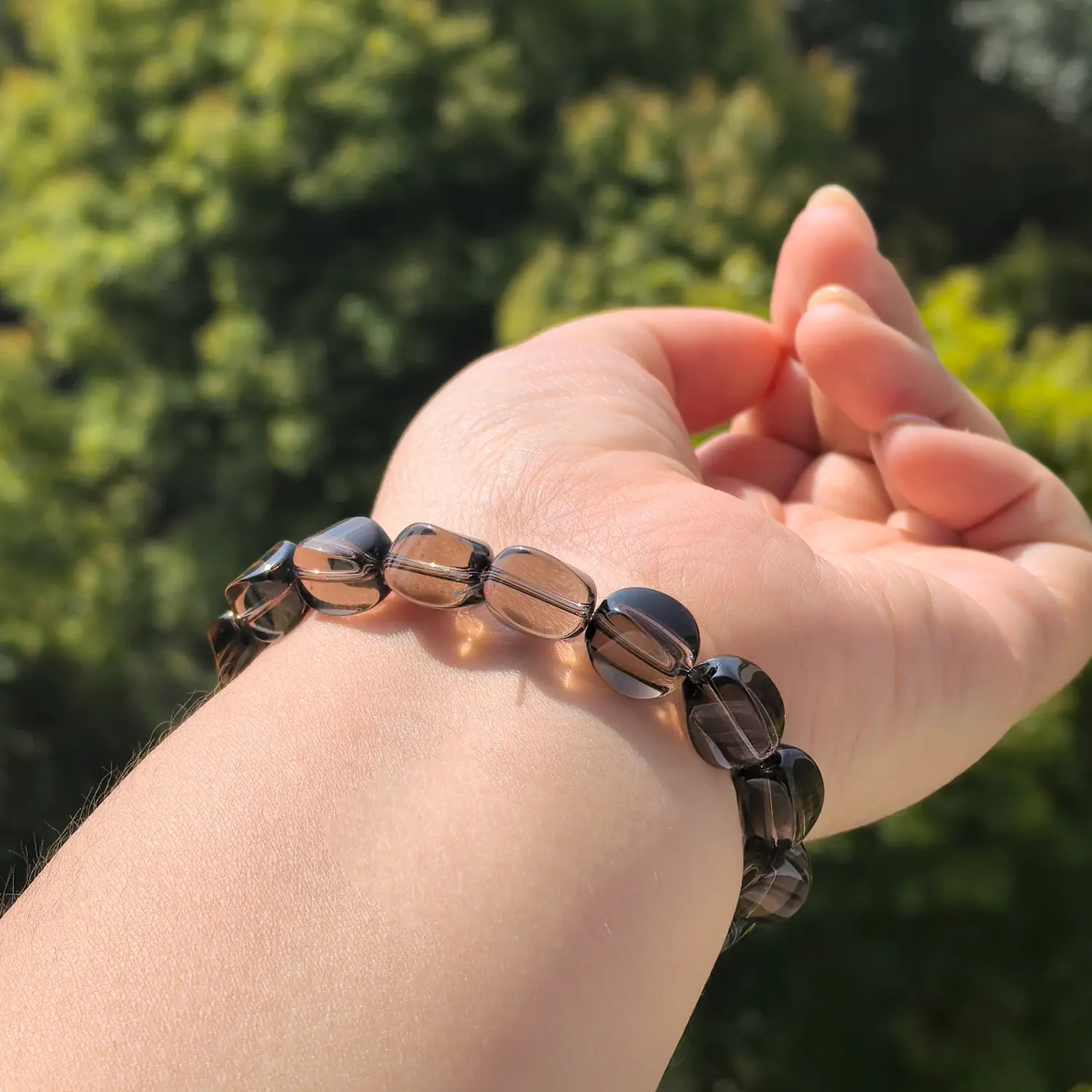 Clear Quartz Smoky Quartz Bracelet worn on wrist in natural light | QZZEN