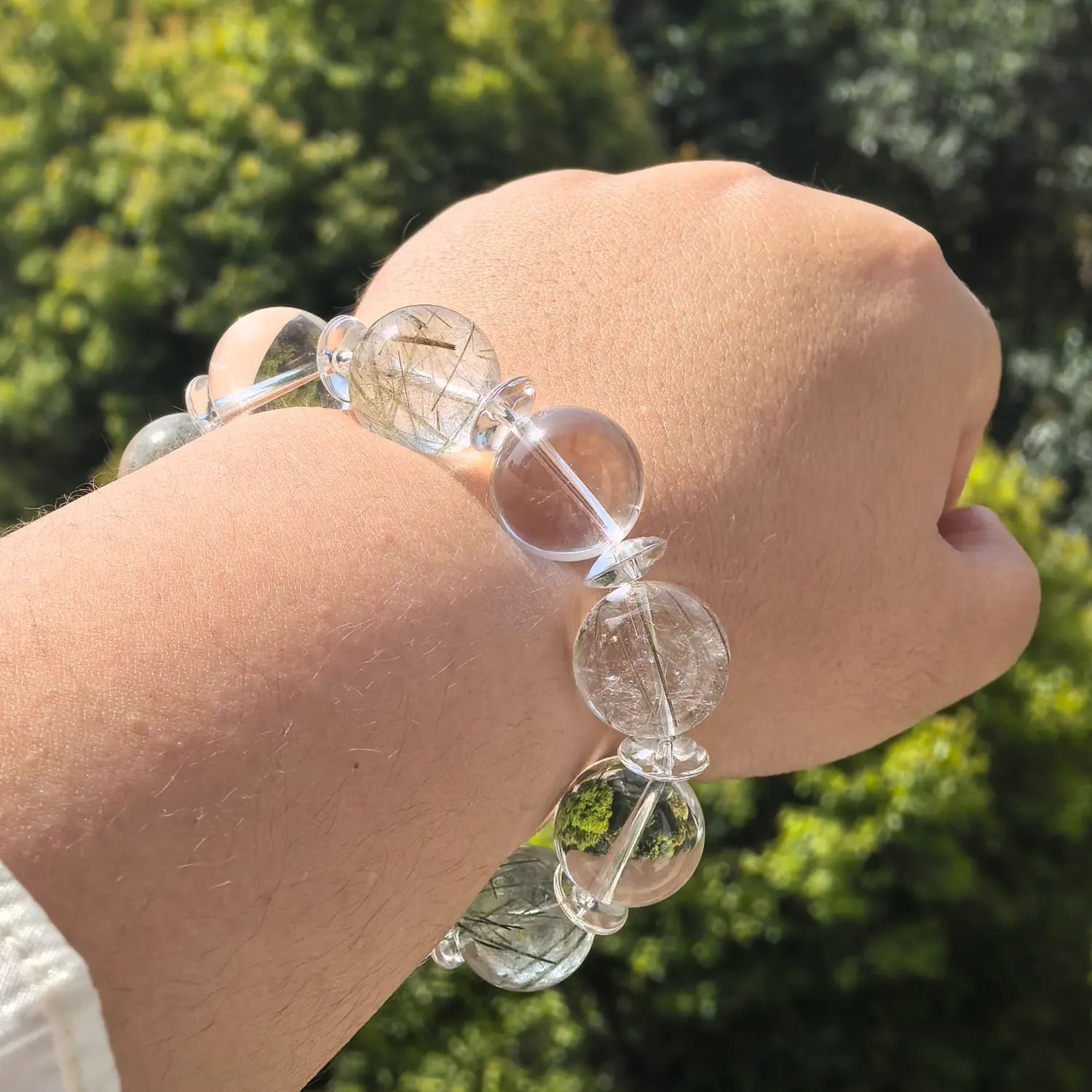 Clear Quartz Green Rutilated Quartz Bracelet worn on wrist in natural light | QZZEN