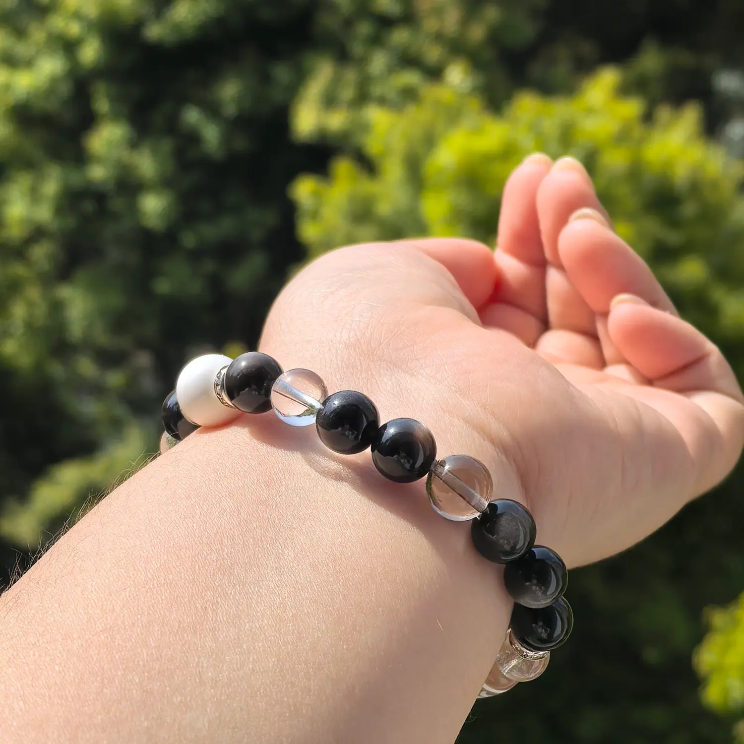 Clear Quartz Silver Obsidian Bracelet worn on wrist in natural light | QZZEN