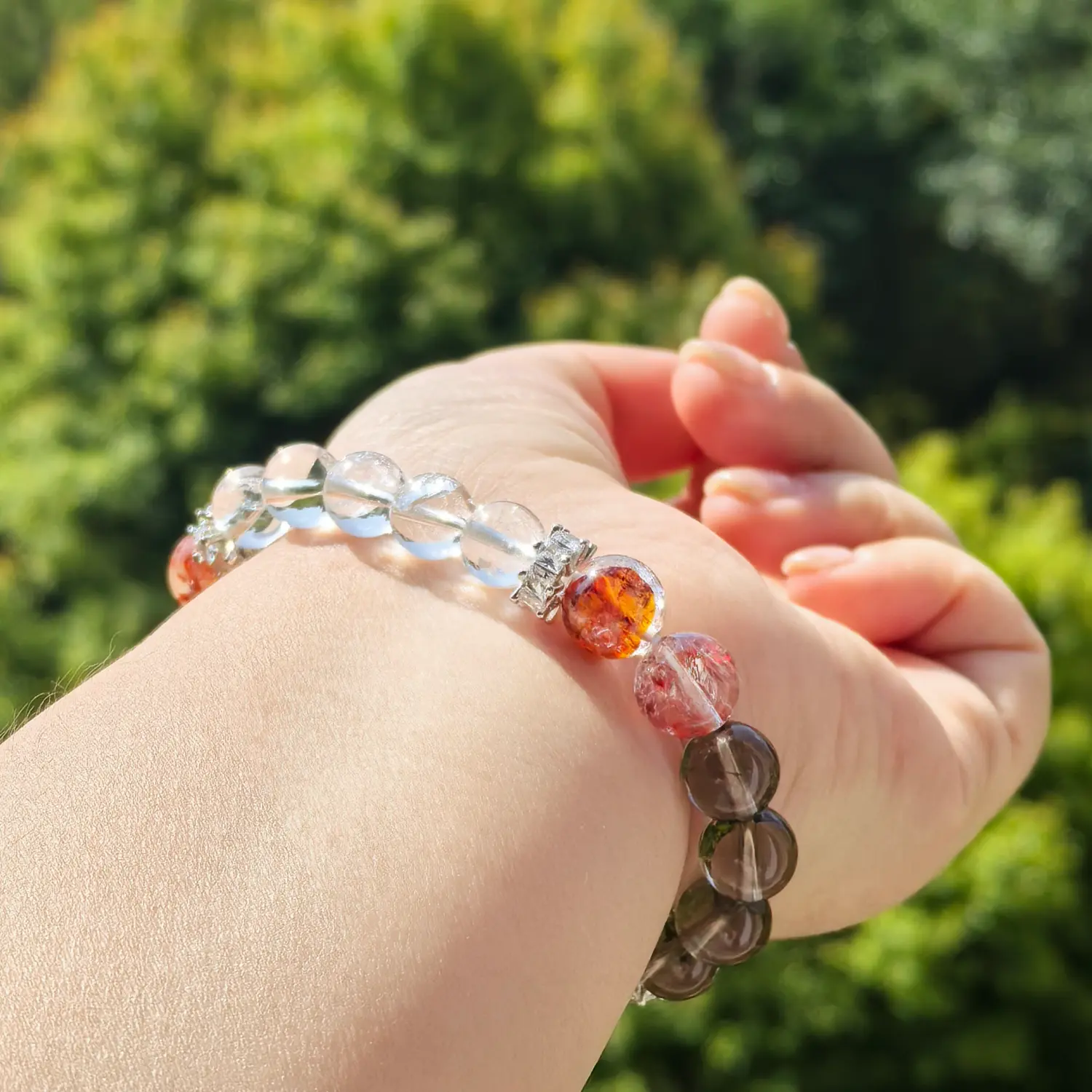 Clear Quartz Red Hematoid Quartz Bracelet worn on wrist in natural light | QZZEN