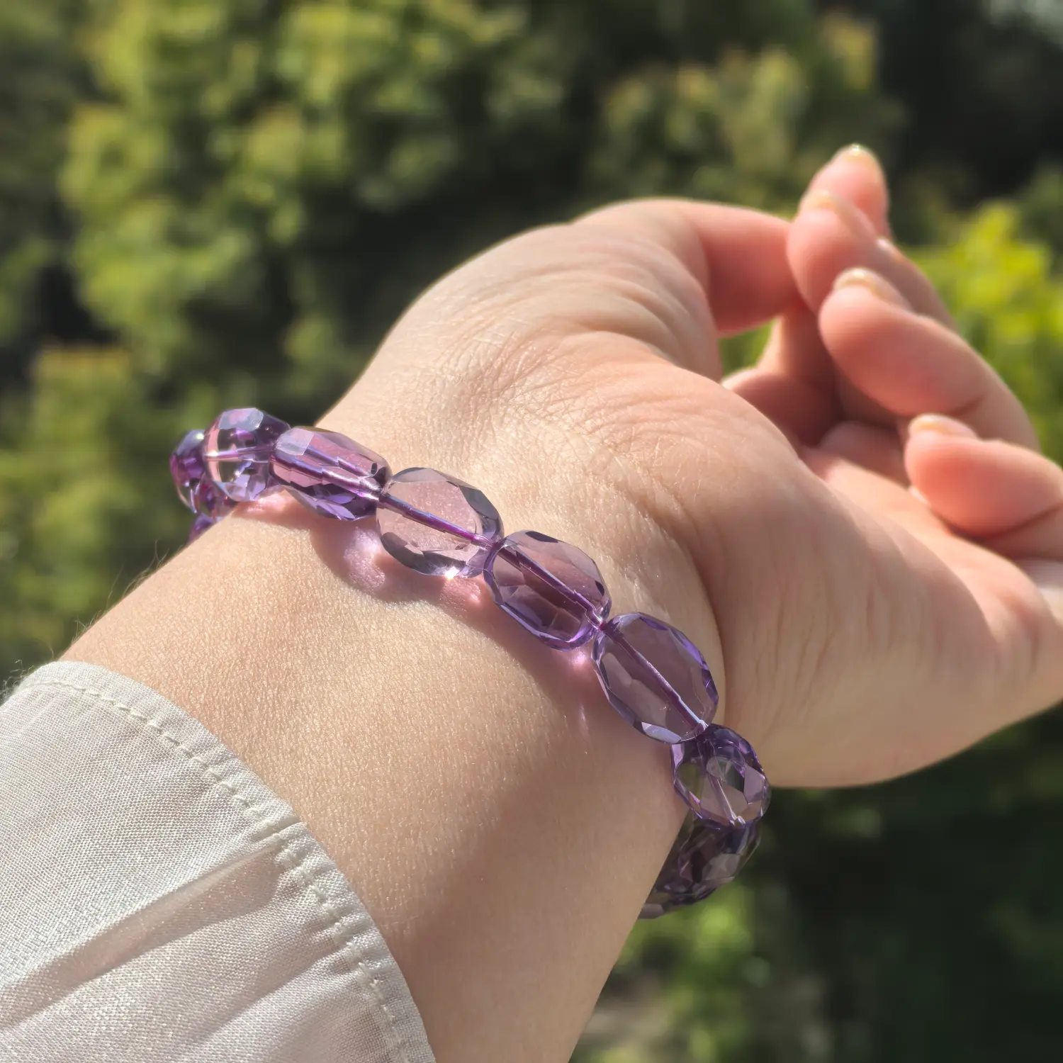 10mm Amethyst Bracelet worn on wrist in natural light | QZZEN