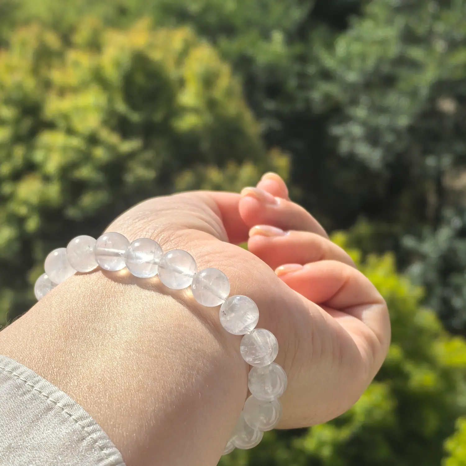 10mm Clear Quartz Bracelet worn on wrist in natural light | QZZEN