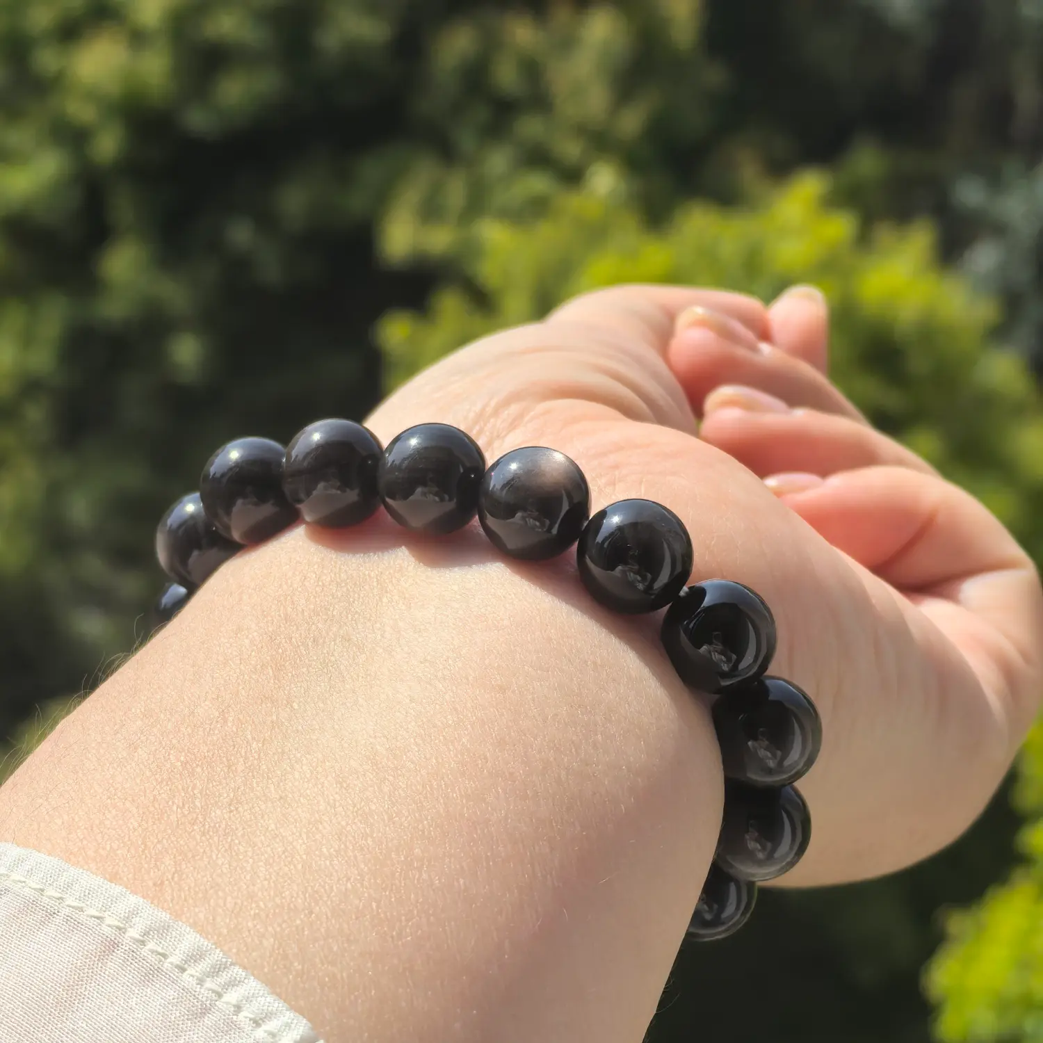 Silver Obsidian Bracelet worn on wrist in natural light | QZZEN