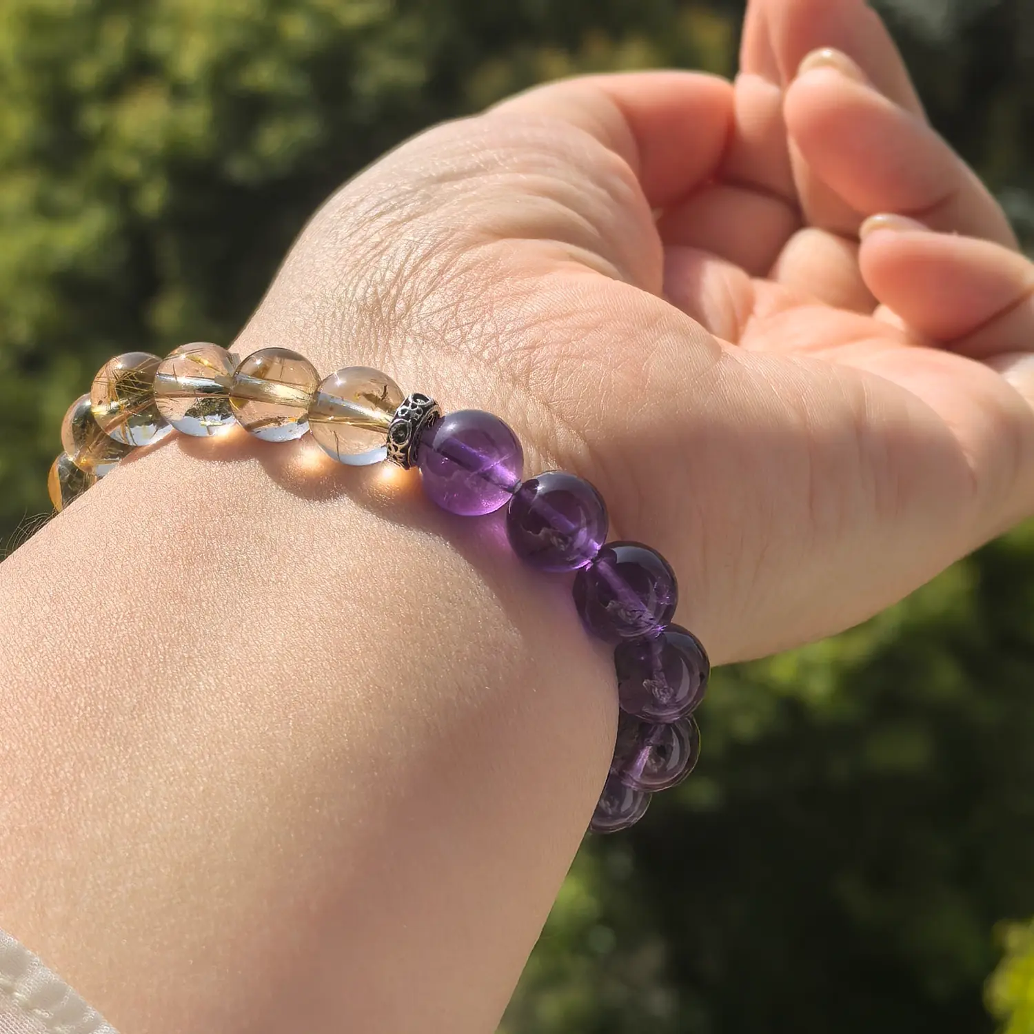 Amethyst Rutilated Quartz Bracelet worn on wrist in natural light | QZZEN