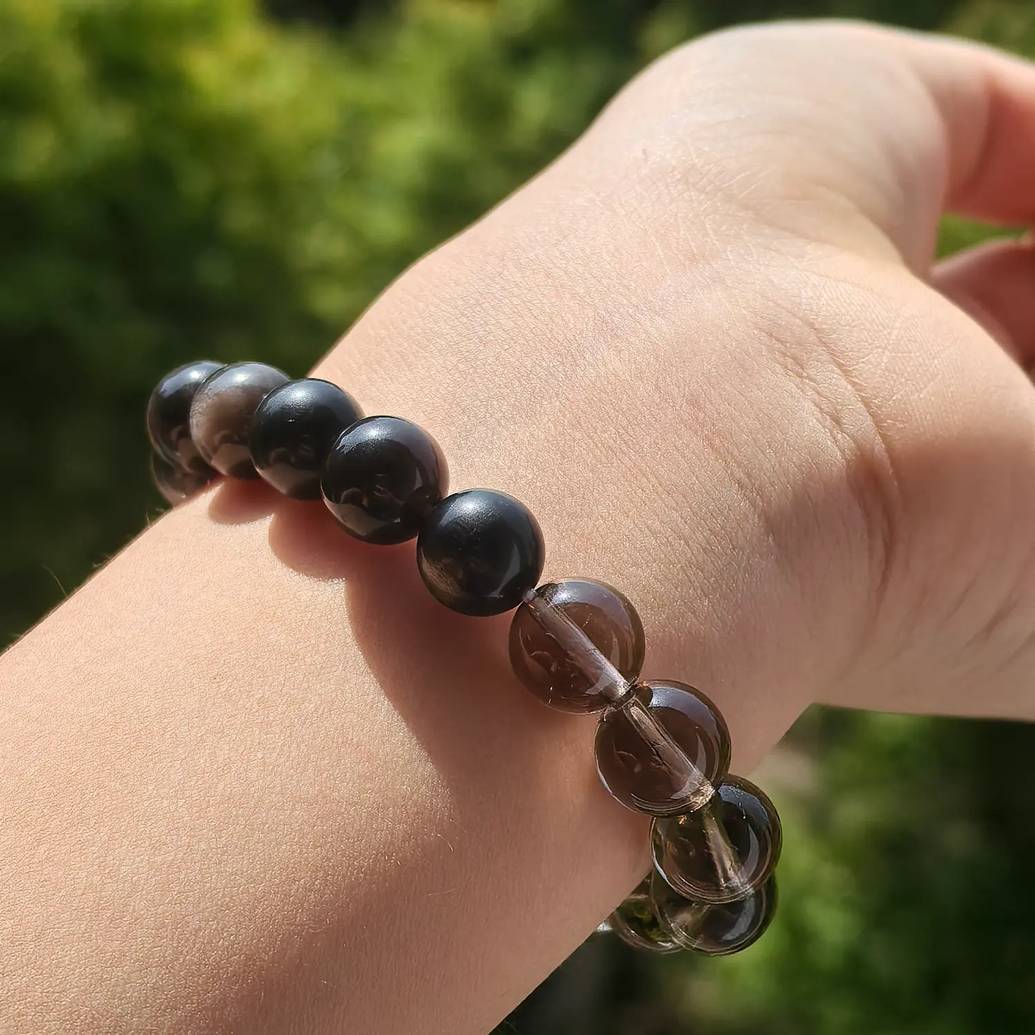Clear Quartz Obsidian Smoky Quartz Bracelet worn on wrist in natural light | QZZEN