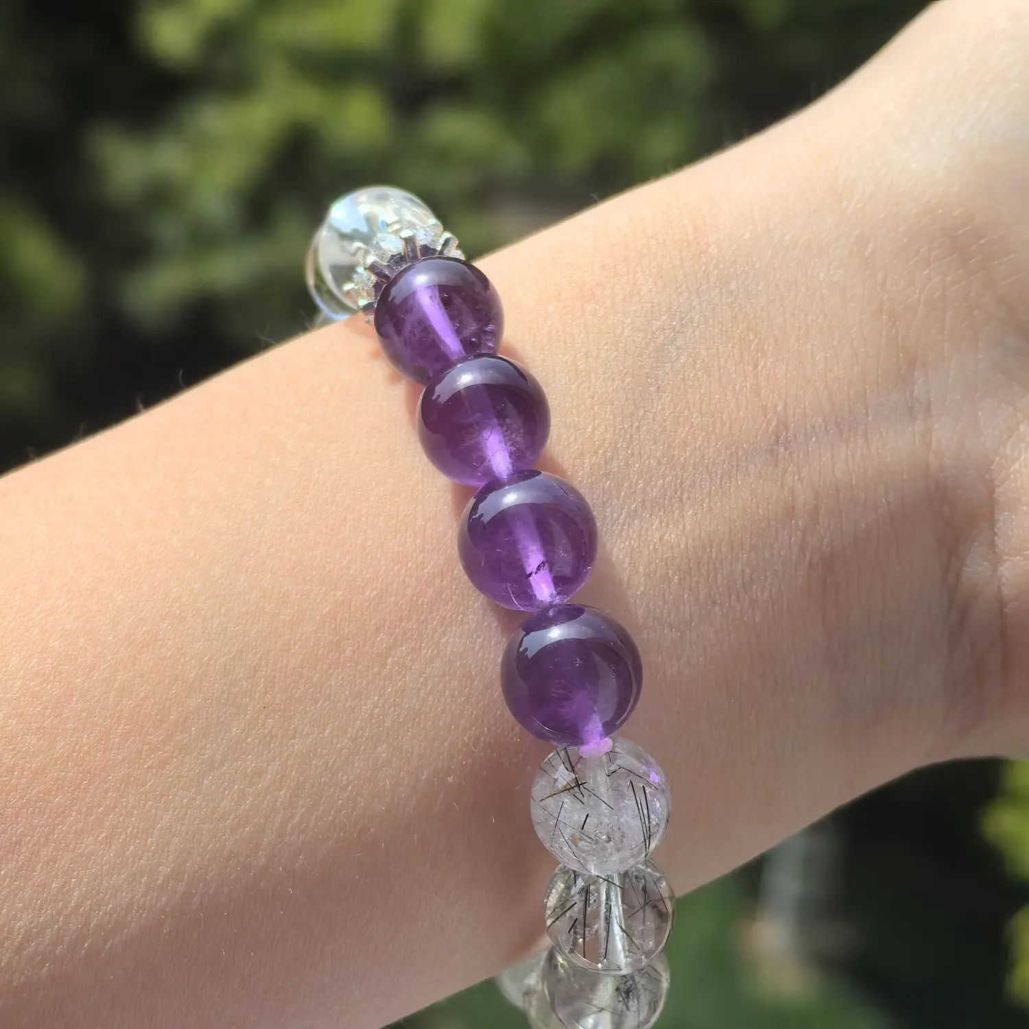 Amethyst Black Rutilated Quartz Rose Quartz Bracelet worn on wrist in natural light | QZZEN