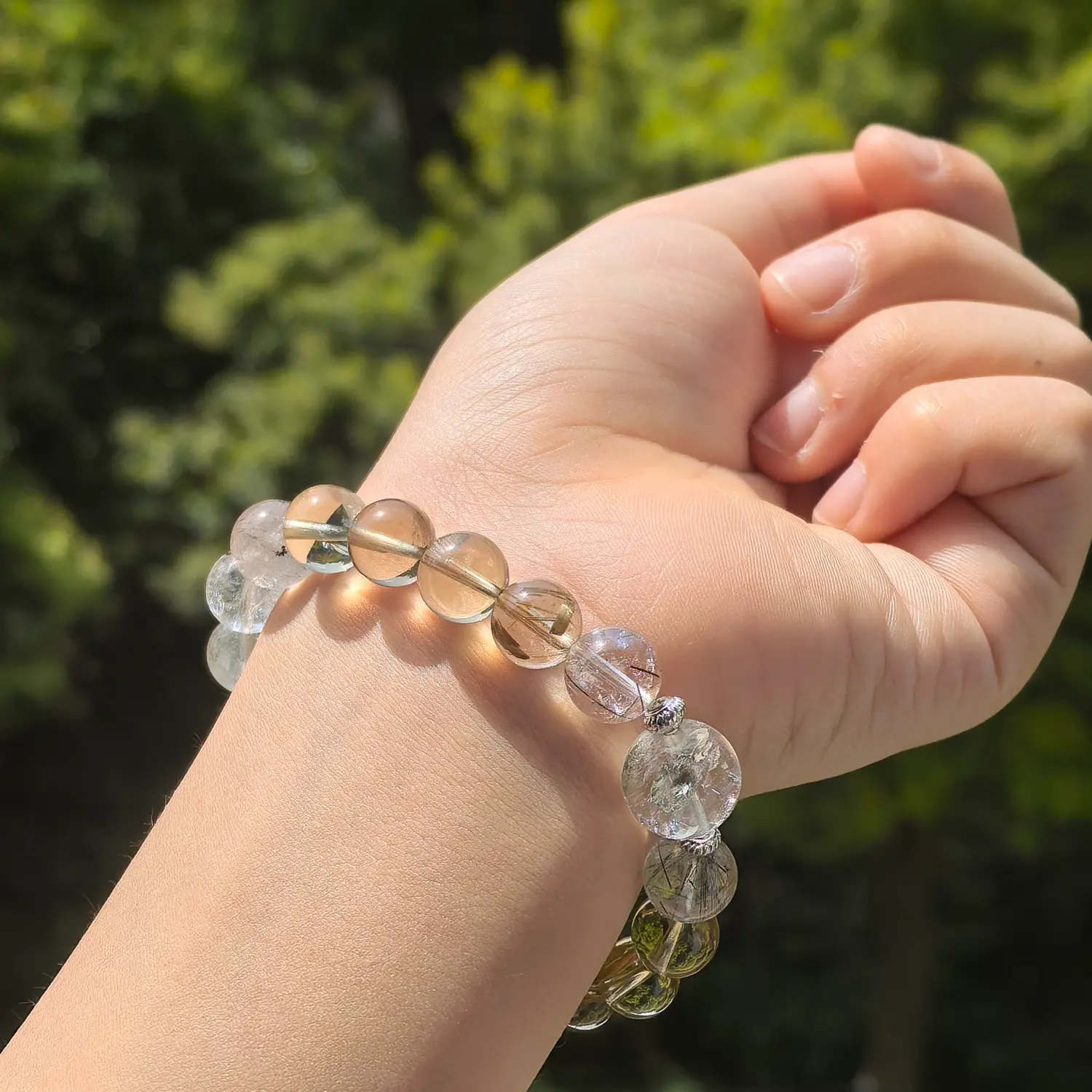 Clear Quartz Rutilated Quartz Smoky Quartz Bracelet worn on wrist in natural light | QZZEN