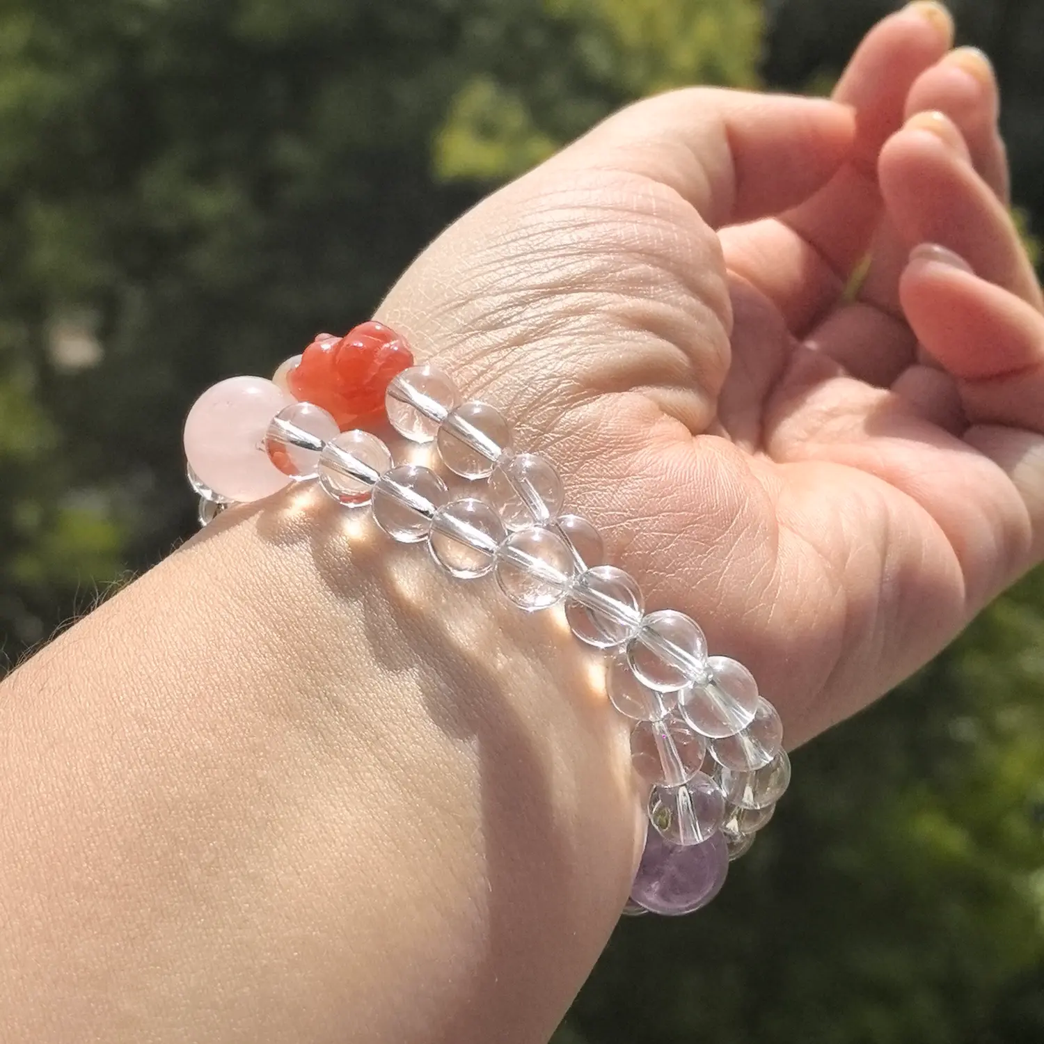 Amethyst Rose Quartz Clear Quartz Bracelet worn on wrist in natural light | QZZEN