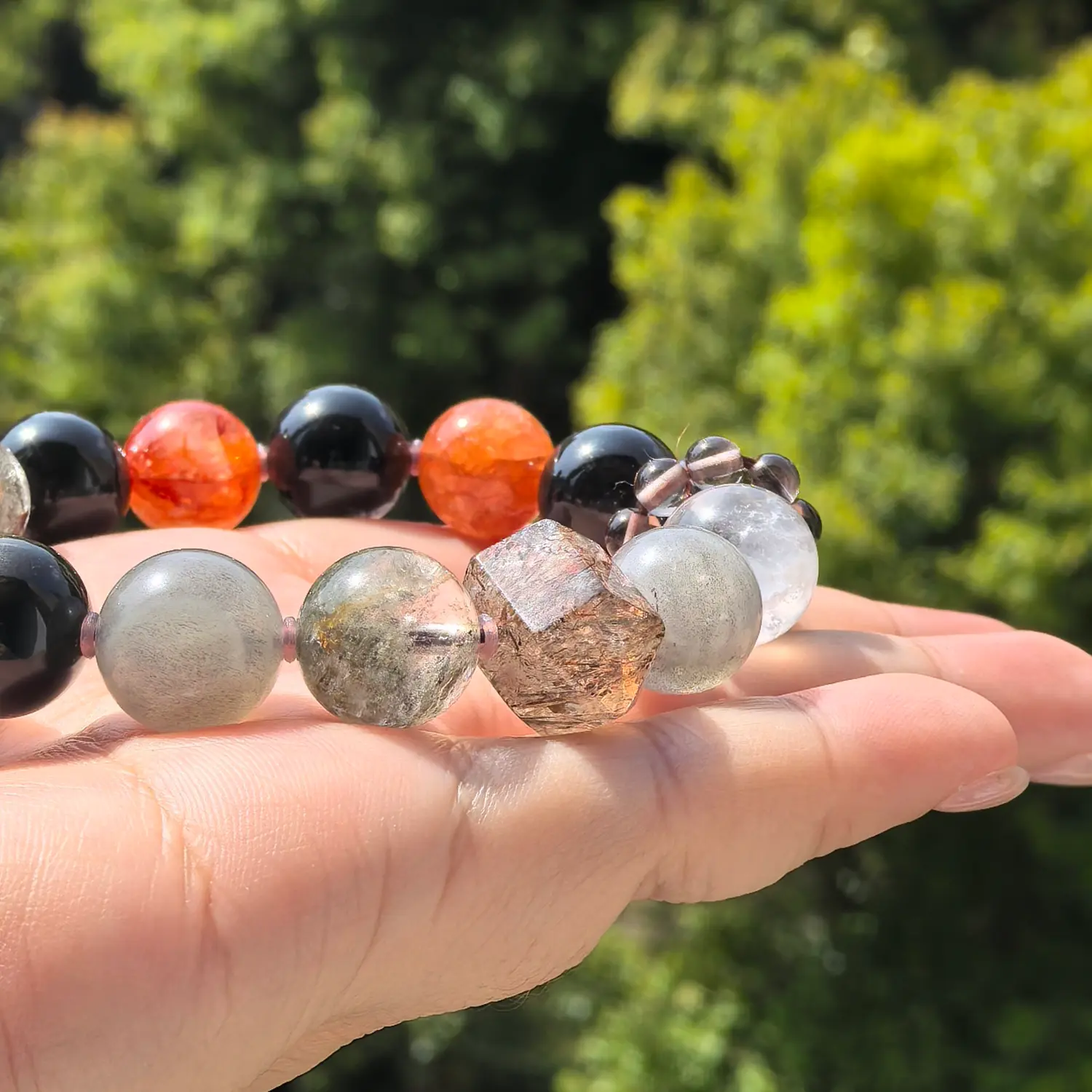 Clear Quartz Obsidian Red Hematoid Quartz Bracelet bead texture close-up with natural inclusions | QZZEN
