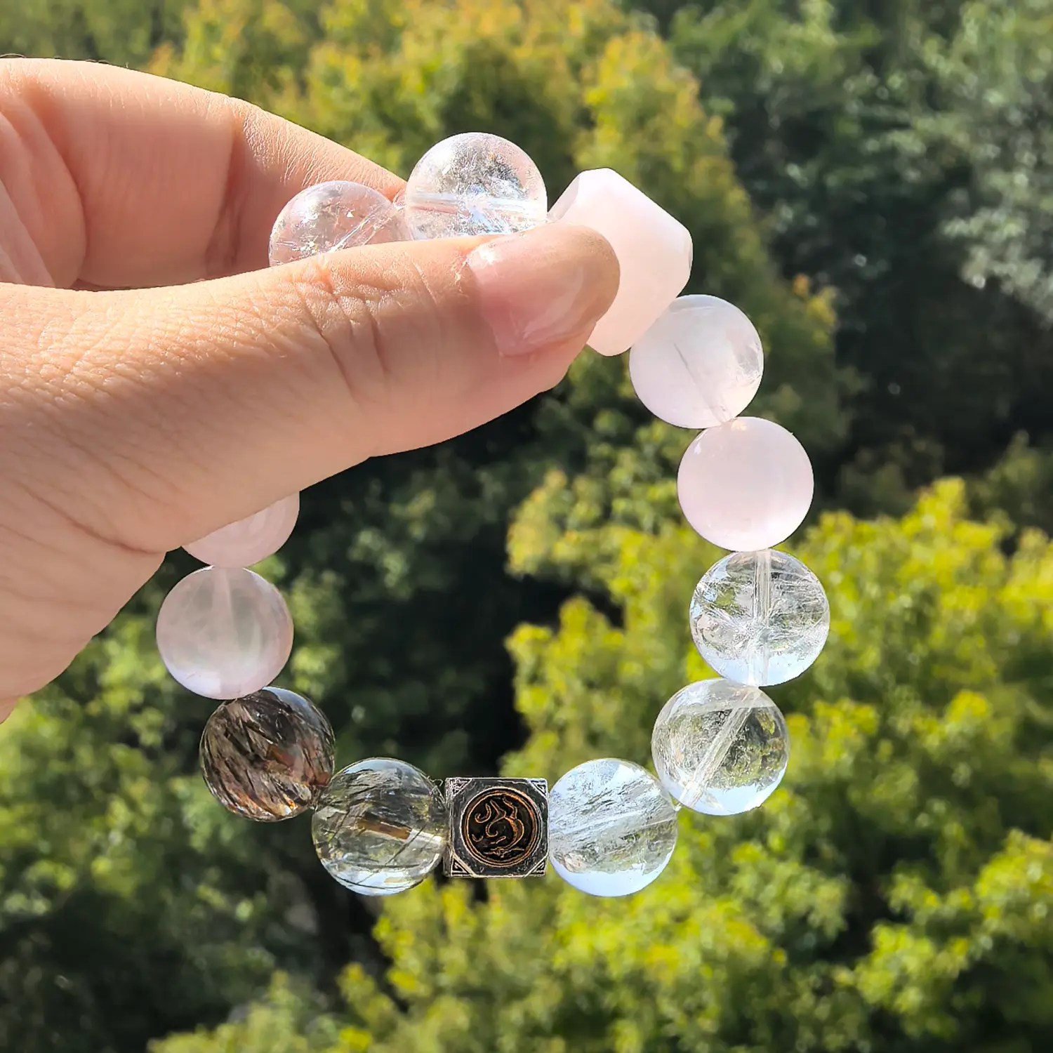 White Phantom Quartz Black Rutilated Quartz Bracelet styled flat lay with calm ritual details | QZZEN