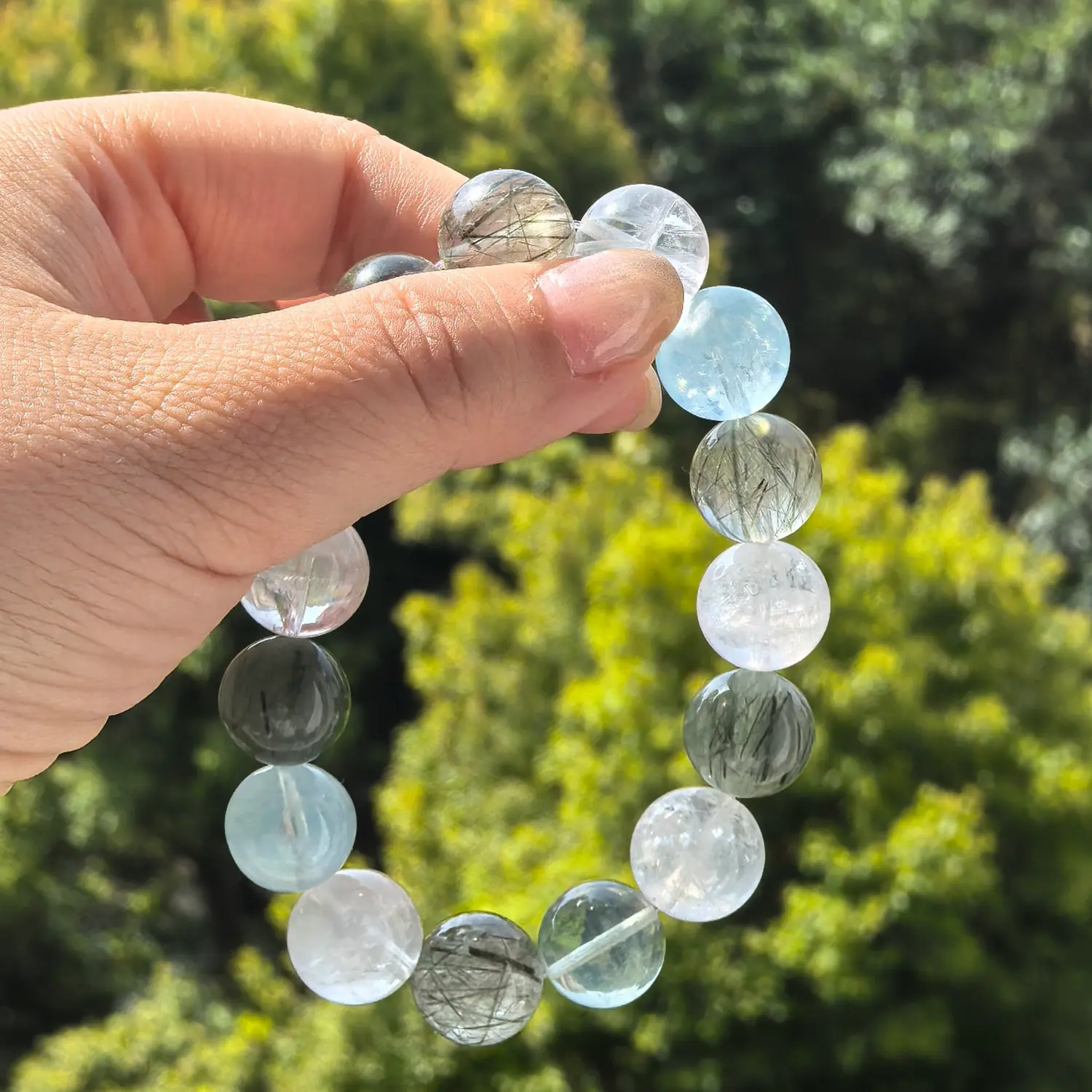 Clear Quartz Aquamarine Black Rutilated Quartz Bracelet styled flat lay with calm ritual details | QZZEN