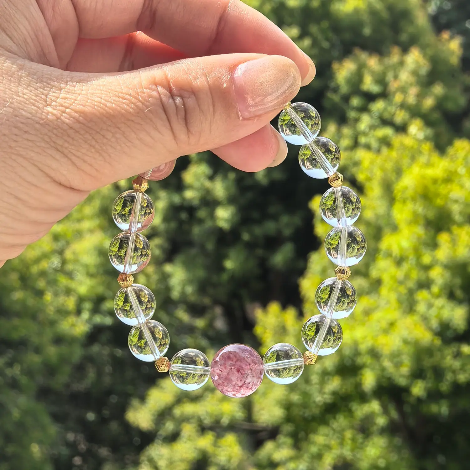 Clear Quartz Strawberry Quartz Bracelet styled flat lay with calm ritual details | QZZEN