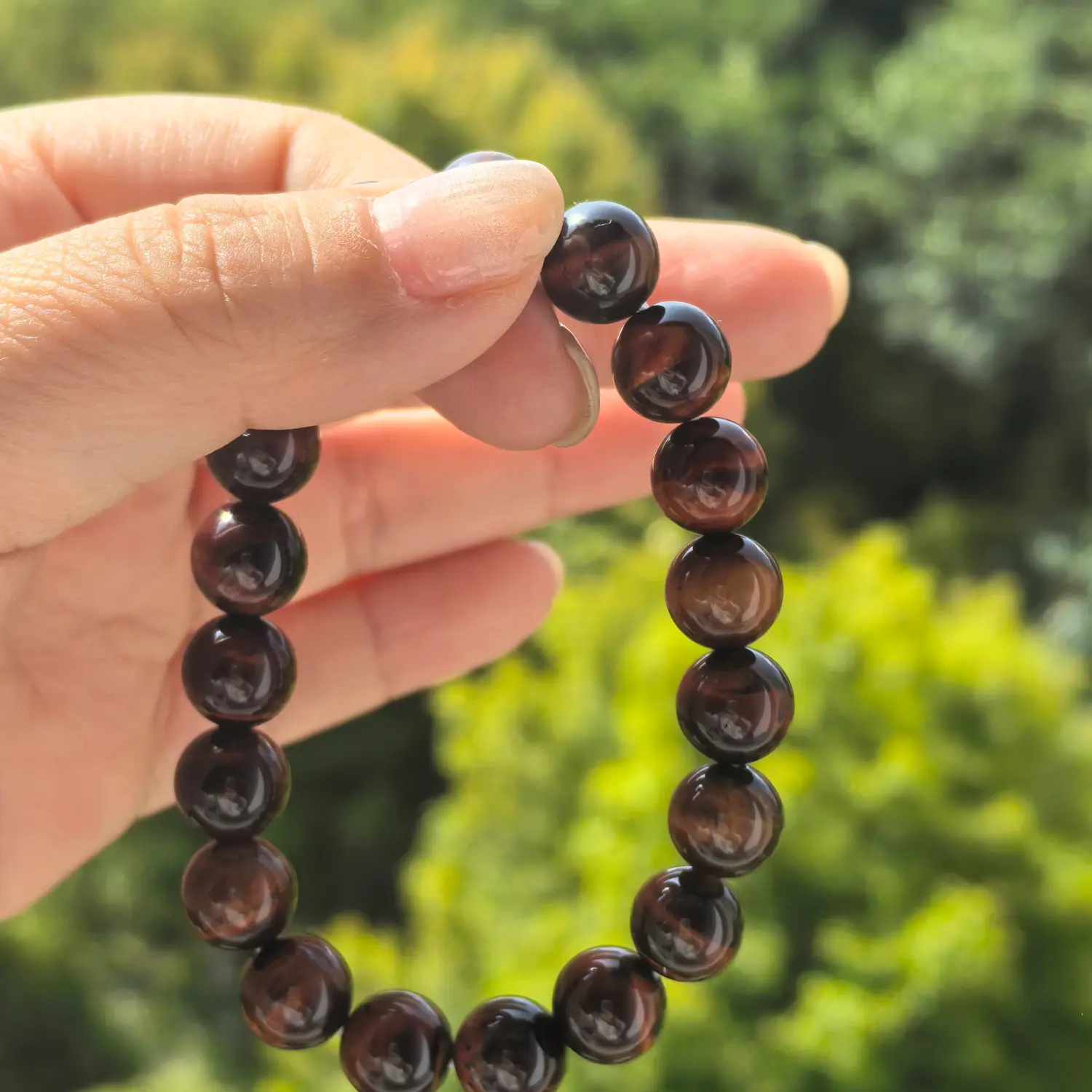 10mm Tiger Eye Bracelet styled flat lay with calm ritual details | QZZEN