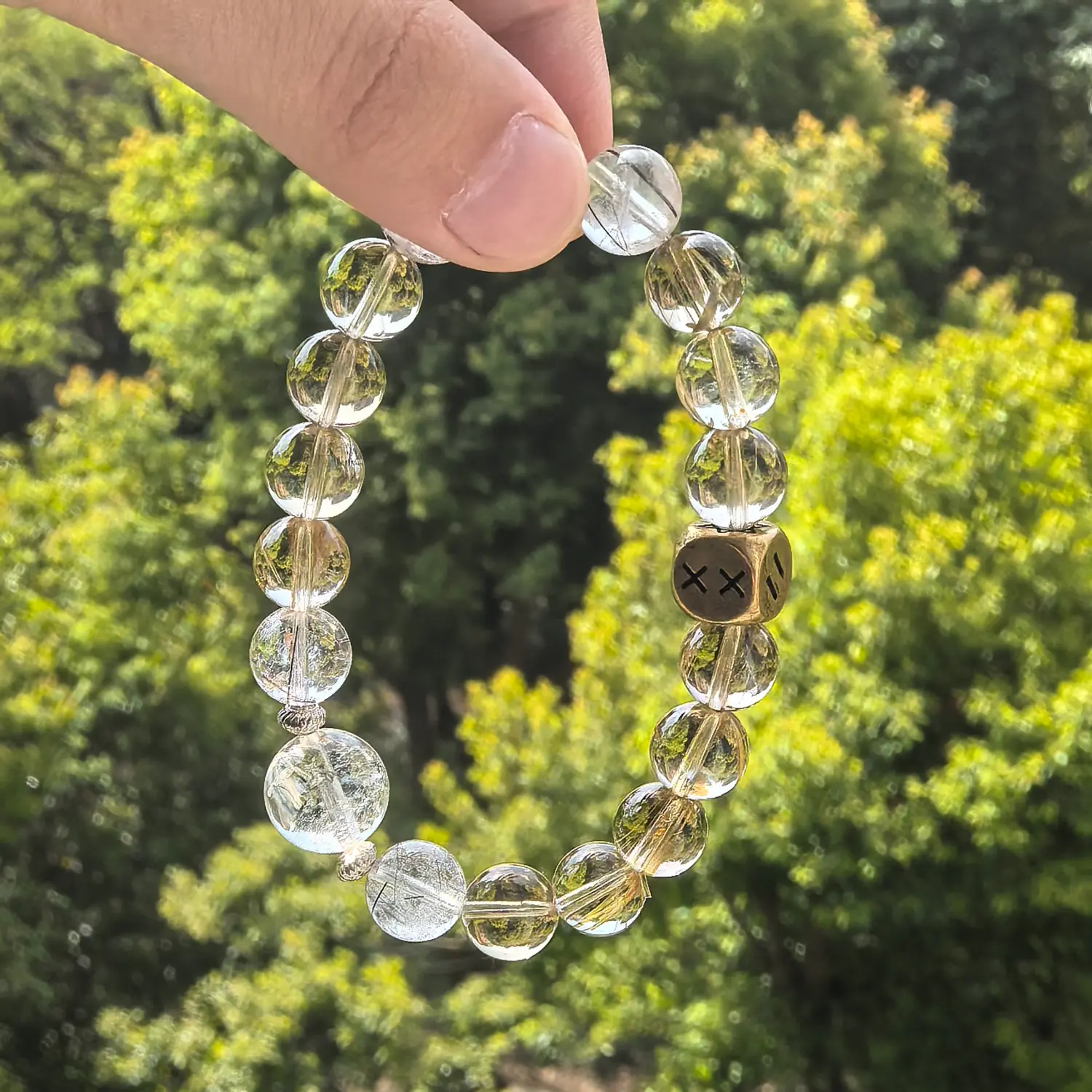 Clear Quartz Rutilated Quartz Smoky Quartz Bracelet styled flat lay with calm ritual details | QZZEN