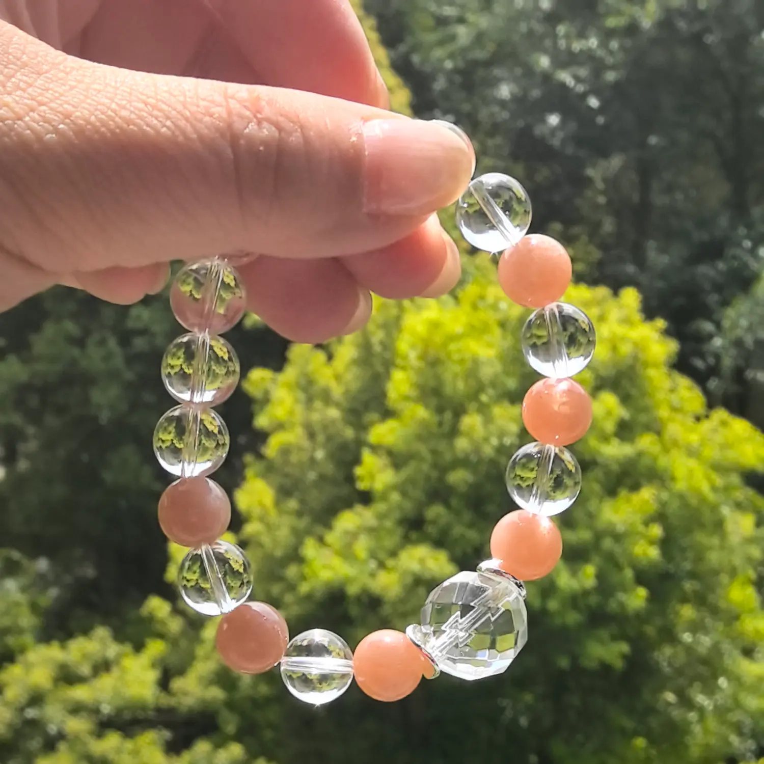 Clear Quartz Sunstone Bracelet styled flat lay with calm ritual details | QZZEN
