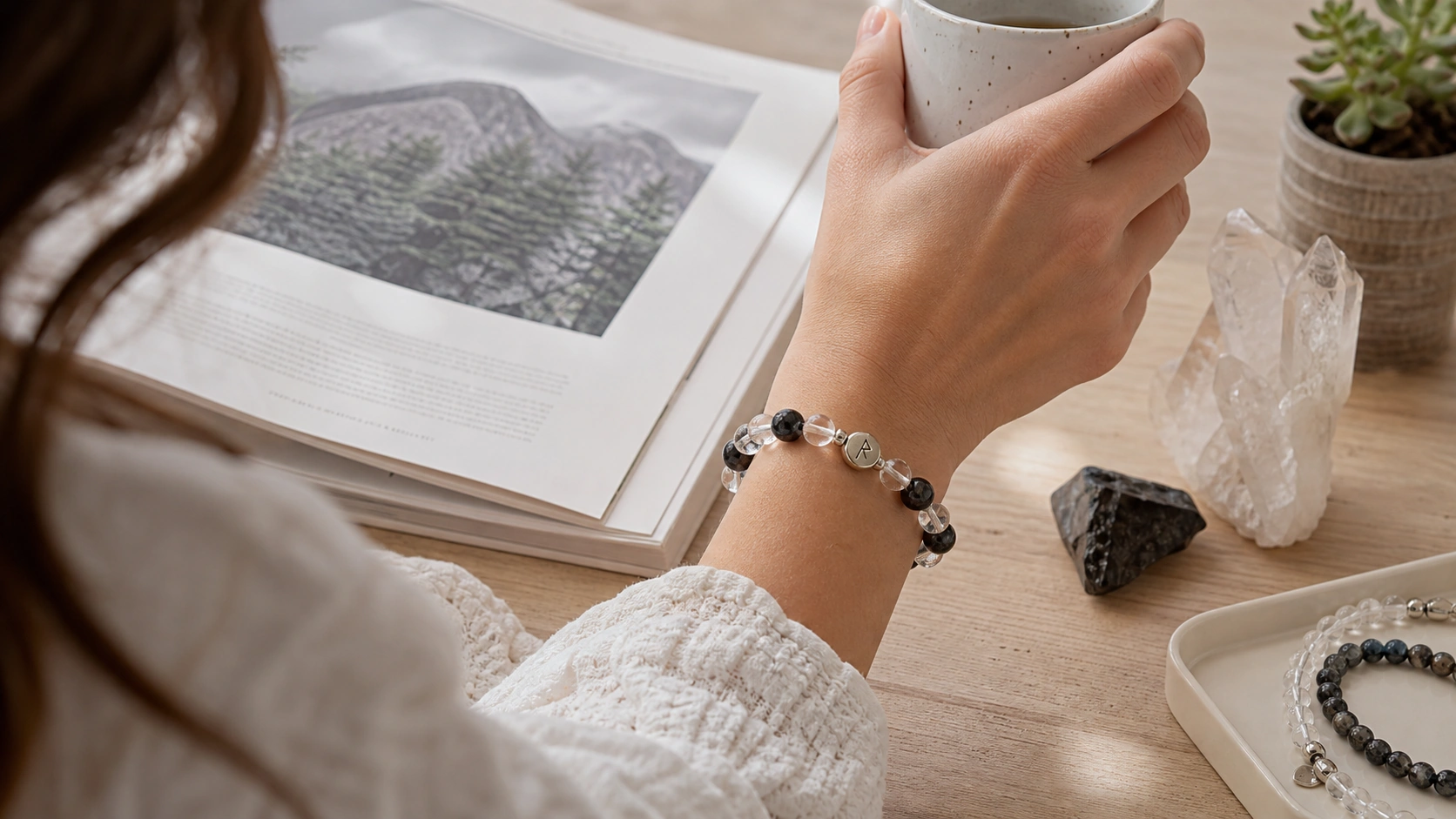 Dark obsidian and quartz bracelet worn while reading